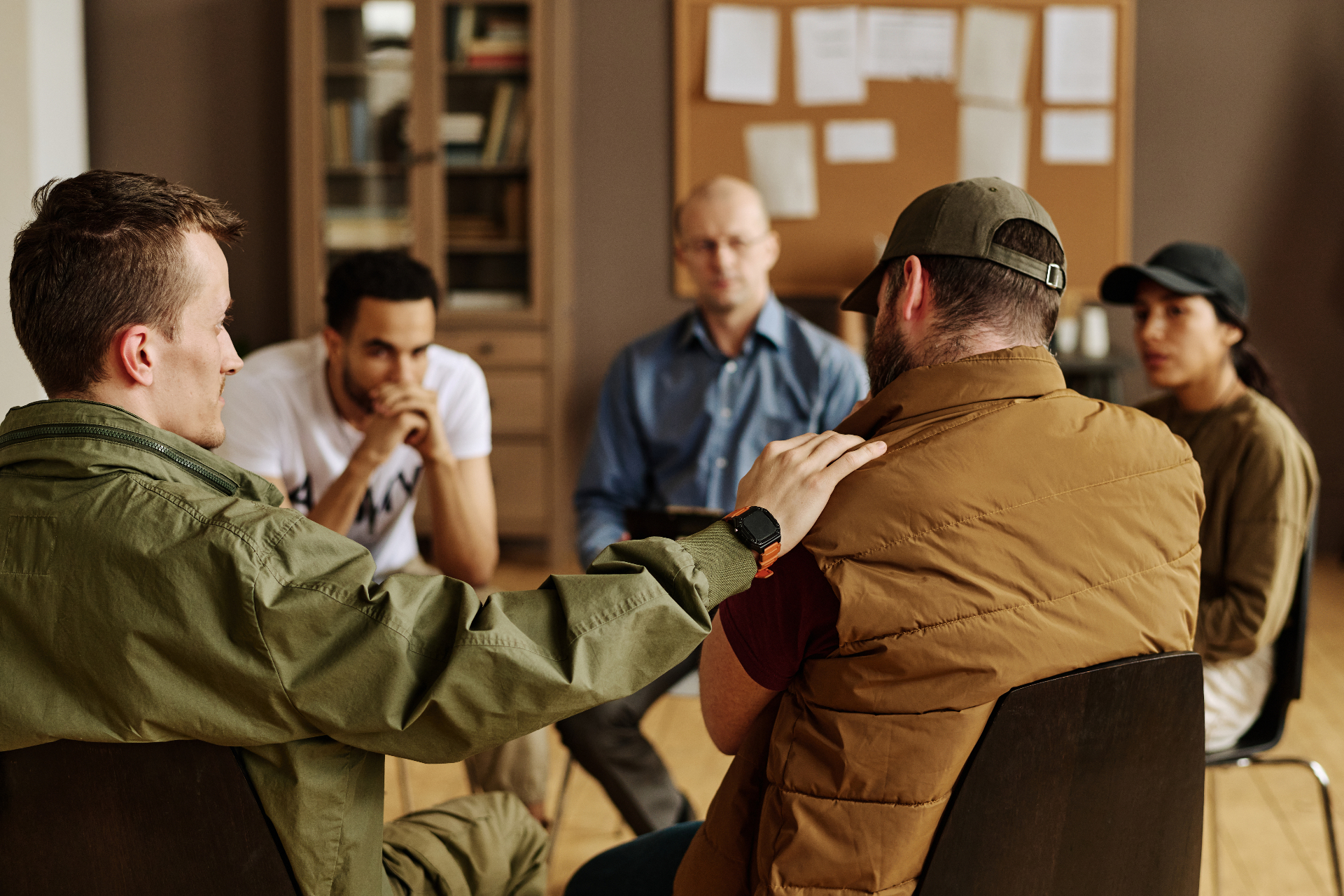 A small group of men in an honest sunlit conversation.